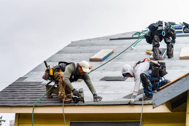 Professional Gutter Installation technician working in Arverne, NY